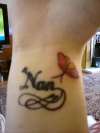 name and butterfly on wrist tattoo