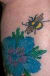 my bee landing on flower tattoo