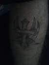 tribal and cross tattoo