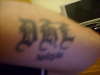 initails arm tattoo