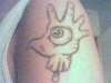 An Eye in a Severed hand tattoo