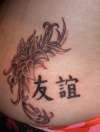 Flower with chinese symbols tattoo
