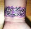 Live laugh love tattoo on wrist