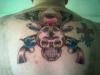 skull and guns tattoo
