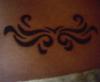 "On my lower back" tattoo