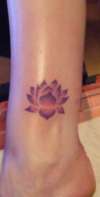 Stencil style lotus flower on ankle tattoo