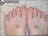 foot hearts tattoo