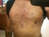 sacred heart with skull and roses tattoo