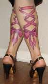 Healed Corset Bow Tattoo's on my legs