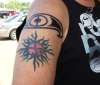 tribal sun w/ the sign of kronos tattoo