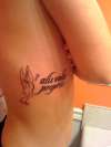 She flies with her own wings (Latin) tattoo