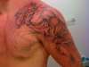 left arm demon tat tattoo