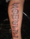 name carved in stone tattoo