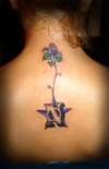 stylist N + flower tattoo
