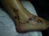Vine on foot with Name Thru tattoo