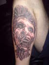 Face from Saw tattoo