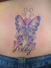 lower back purple butterfly tattoo