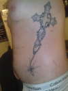 Cross and roseary tattoo