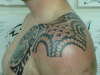 shoulder cap tattoo