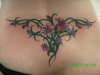 flowers lower back tattoo
