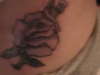 rose on left hip tattoo