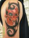 skull n trible tattoo