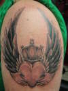 Wings with heart tattoo