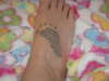 My sons footprint,on my foot tattoo