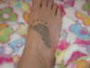 My sons footprint,on my foot tattoo