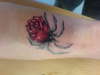 a spider rose tattoo