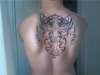 Tribal wings with cross tattoo