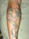 dragon on cross tattoo