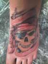 pirate skull on foot tattoo