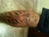 Cross on calf tattoo
