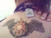 sun and wings tattoo