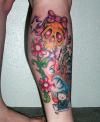 girl skull & flowers tattoo